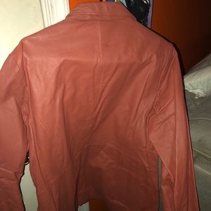 Leather blazer rust in color.